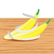 Banana with measure tape and table wood