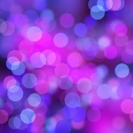 Blurred purple and blue bokeh dots on black background