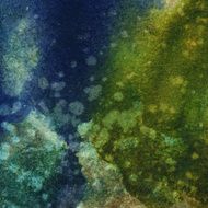 Blue and green watercolor background with paint splatters