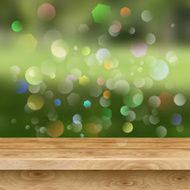 Empty table of wooden planks on summer background