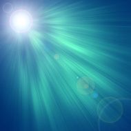 Sun on blue sky with lenses flare