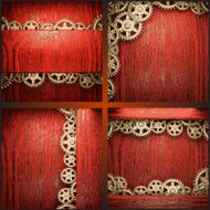 gear wheels on red wood background