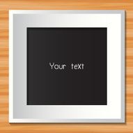 Photo frame on wooden background