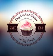 Pink cupcake with label over blurred background