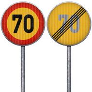 Two yellow and red maximum speed limit 70 road signs