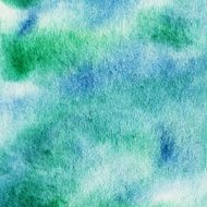 Mottled watercolor background of blue and green