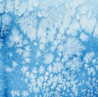 Wintery blue watercolor background with frost