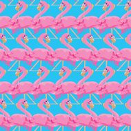 Seamless pattern with pink flamingos on blue background