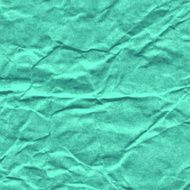 Background of crumpled paper in turquoise color