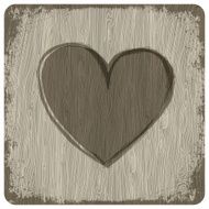 Red heart on wooden background