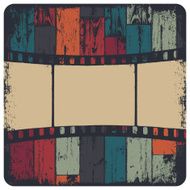 Film strip in grunge frame on colorful seamless wooden backgroun