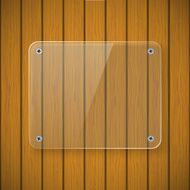Glass plate on the background of wooden wall