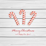 Christmas cane on wooden background
