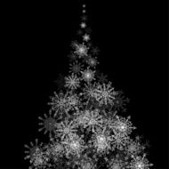 Christmas tree made of snowflakes blizzard in the darkness
