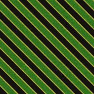 Seamless green glitter pattern on black paper