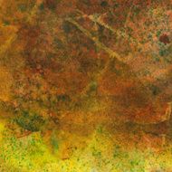 Paint splatter texture on brown and yellow background