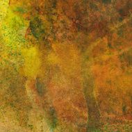 Paint splatters and drips on rust colored painting