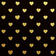 Gold seamless pattern of hearts on black background