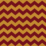 Seamless red and gold chevron pattern on glitter paper