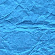 Background of crumpled paper in blue color