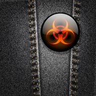 Biohazard badge on black denim texture jacket vector