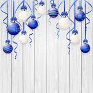Blue Christmas balls on wooden background