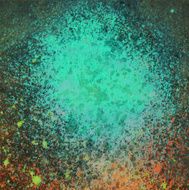 Splatter of blue turquoise paint on a dark background