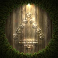 Christmas tree with bright baubles on Wooden background and wreath