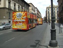 double decker bus on a road in the center of madrid