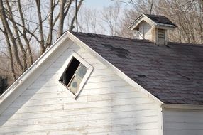 window in a attic with a tiled roof