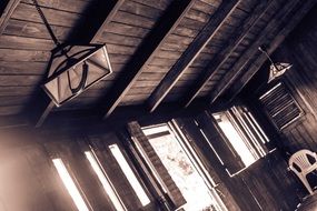 monochrome photo of lamps in a wooden house