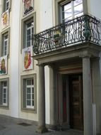 balcony above the entrance to the building