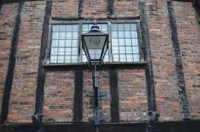 lantern on the background of the facade with a large window