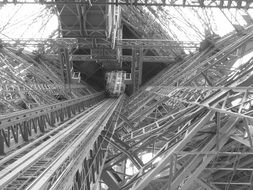 Black and white photo of inside of the Eiffel Tower