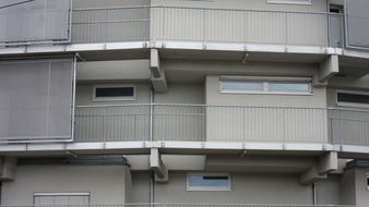 Balconies on the facade with the windows