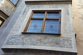 view from below of painted bay window