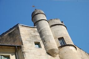 old stone building with turret at sky