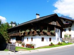 old alpine house with green plants