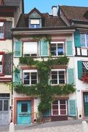 facade in greenery of an old house in the city center