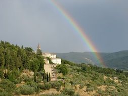 rainbow over a castle in italy