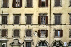 facade of the building with windows and old masonry