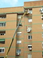 workers at height near the house