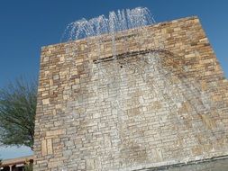 fountain on brick wall background