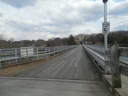 wooden bridge and gray sky