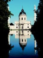 church with white walls near the lake