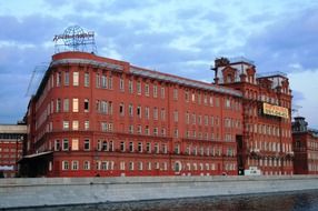 red building with pointed corners on the waterfront