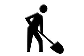 silhouette of a worker with a shovel