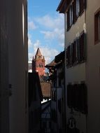 view of the Town Hall Tower from a narrow street