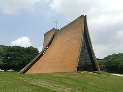 unusual building with a grass roof