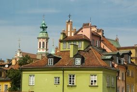 green building in the old town of warsaw